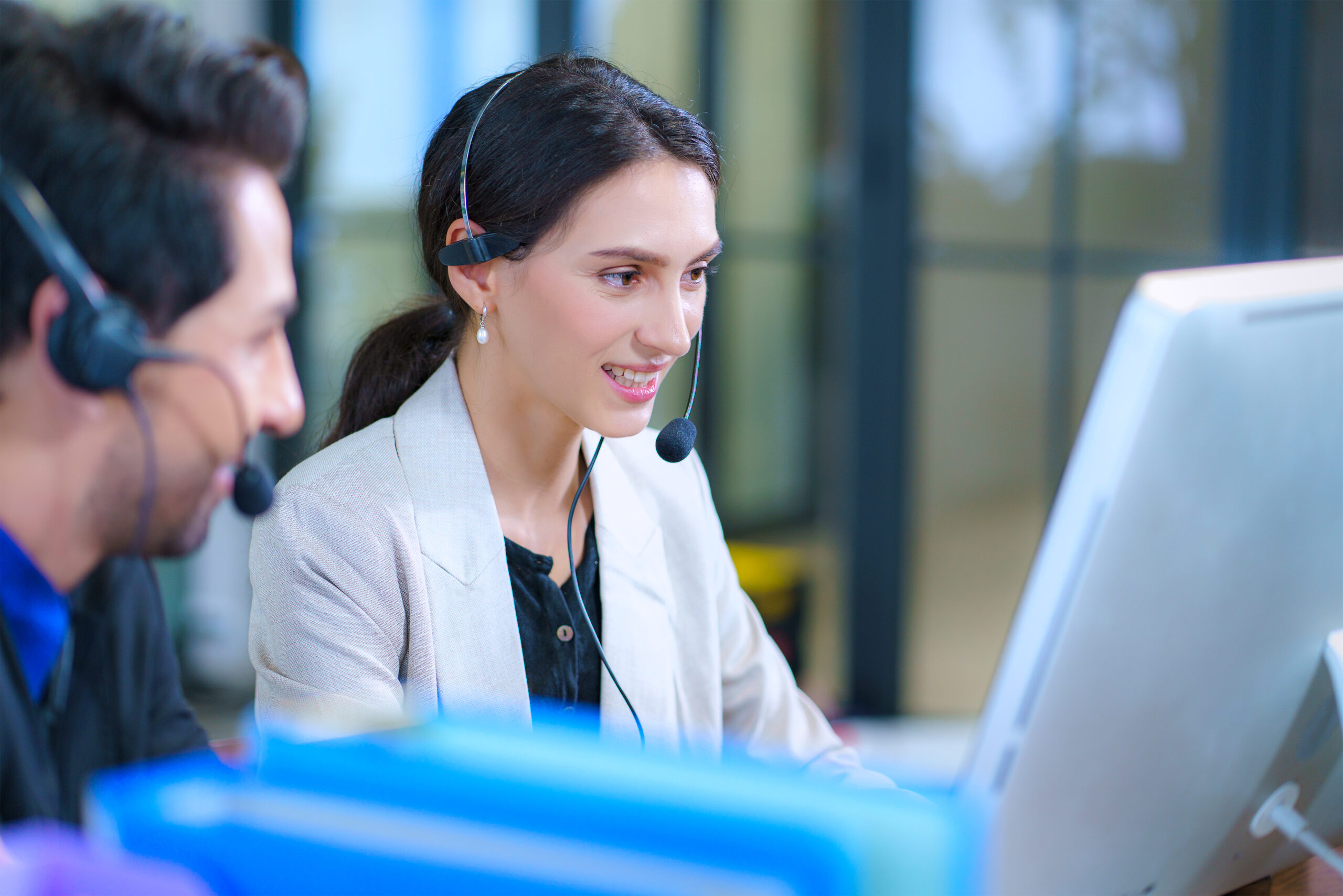 Service desk consultant talking on hands-free phone
