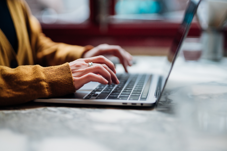 Woman typing on computer