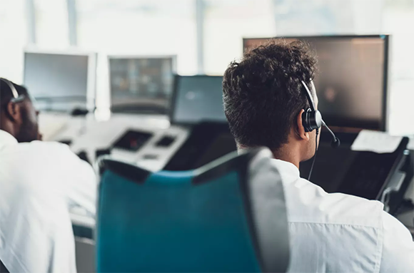 customer service agent analyzing data on a computer